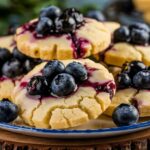 Lemon and blueberry muffins on a rustic table showcasing their perfect flavor pairing.