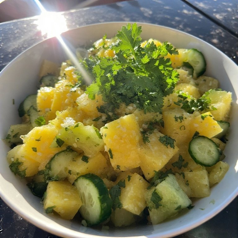 Served pineapple cucumber salad outdoors